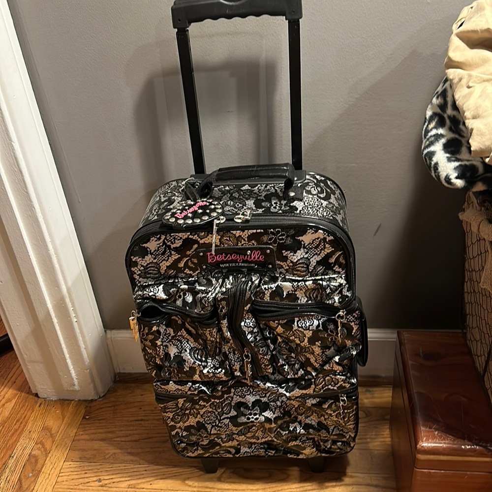 Betsy Johnson rolling luggage